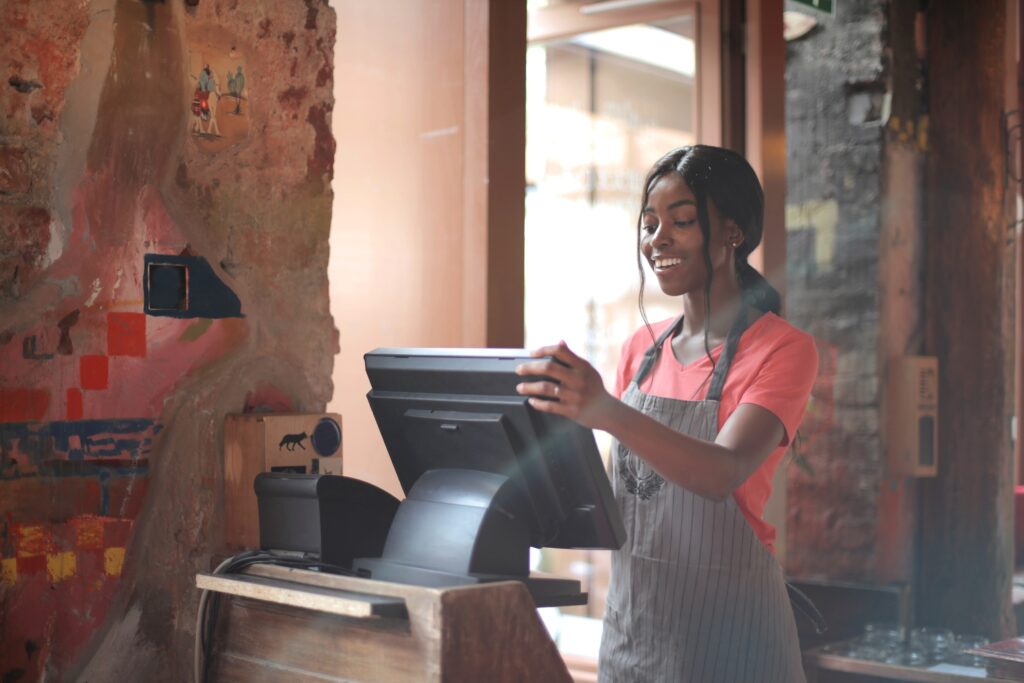 Cashier processing the bill at a restaurant POS