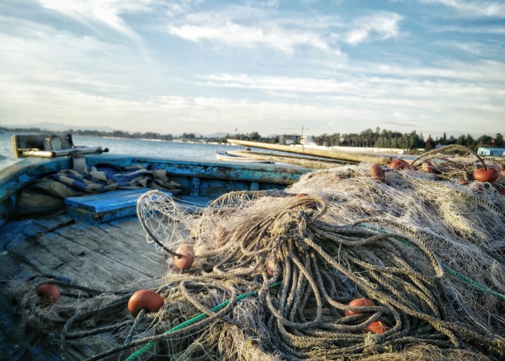 seaside coastline with fishing nets ashore