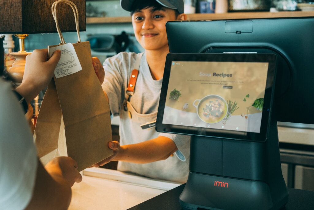 Retail clerk selling goods using customer facing screen