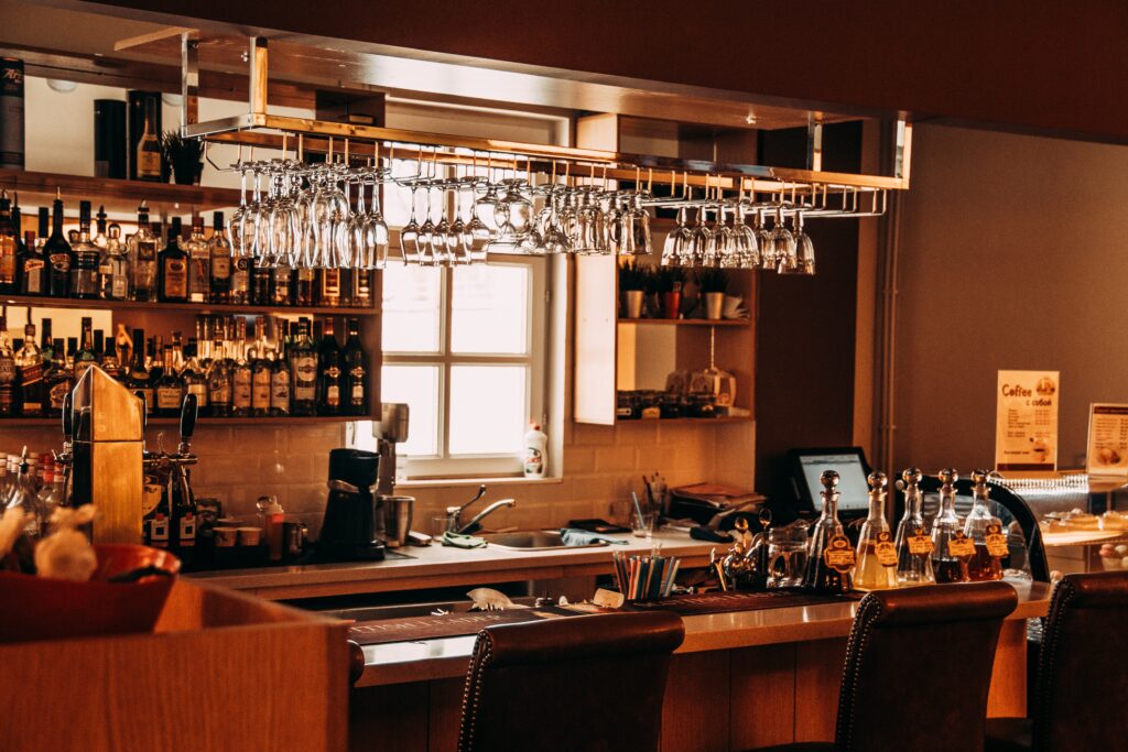 view across restaurant of bar counter with window in background