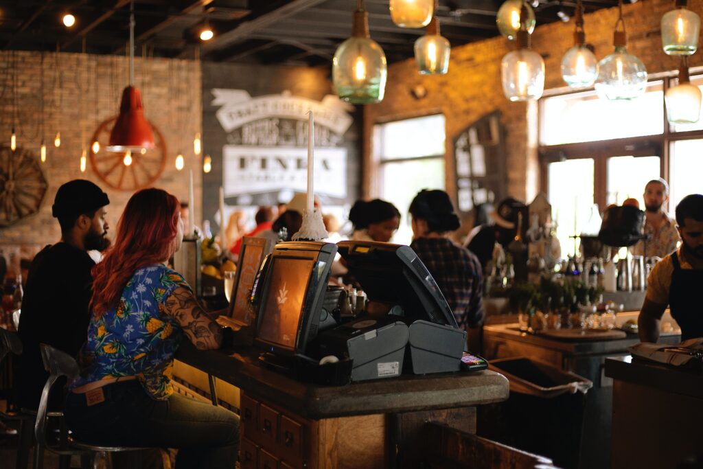 Crowded restaurant with screens